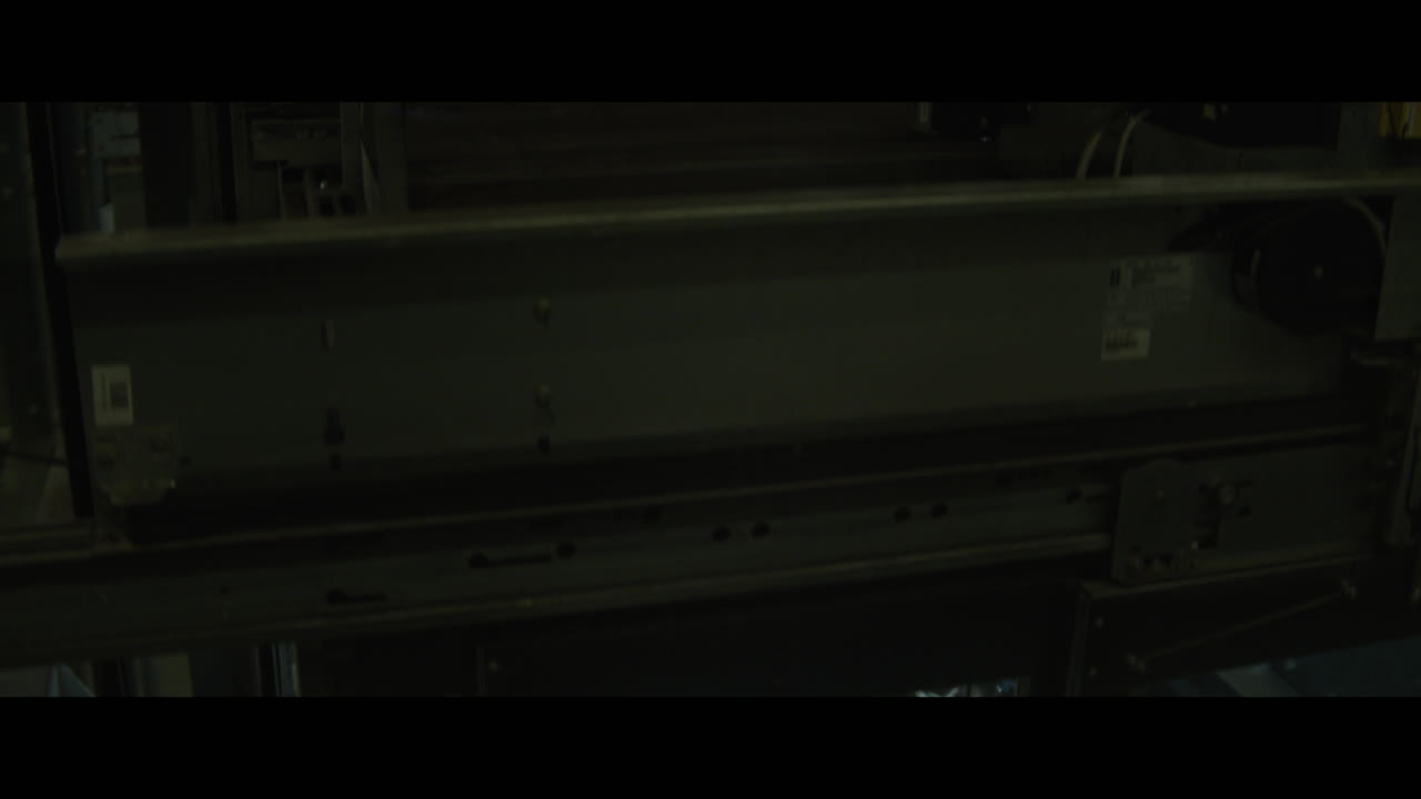 Man with a rabbit head in an elevator