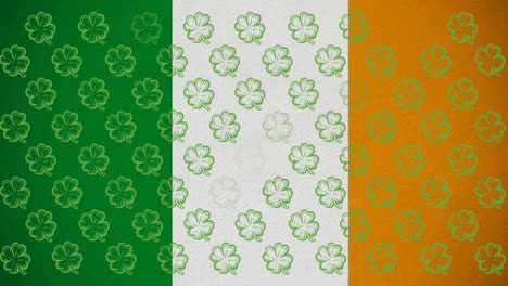 Animación-Digital-De-Múltiples-Hojas-De-Trébol-Flotando-Contra-La-Bandera-Irlandesa