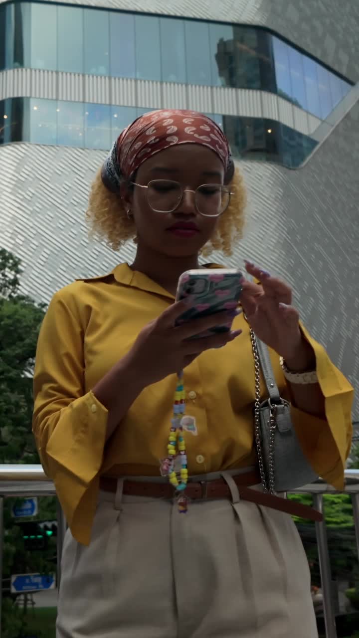 Woman using phone outdoors