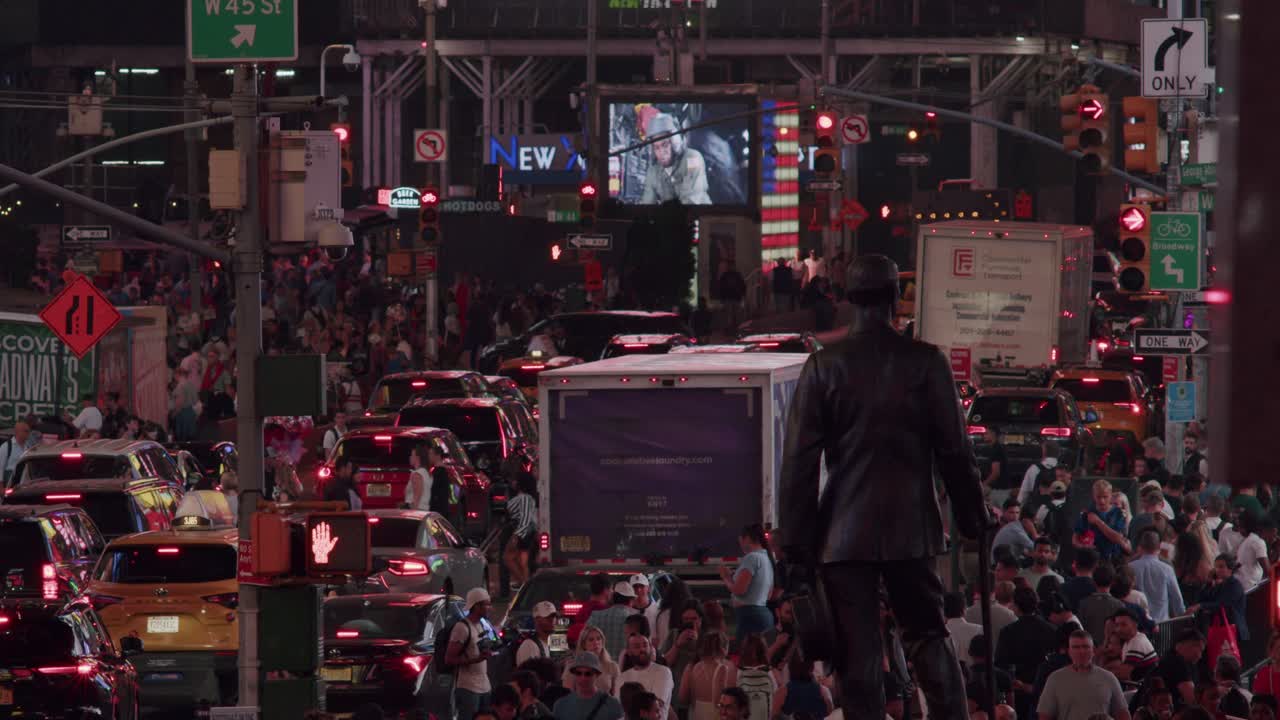 Busy Times Square filled with crowds, traffic, and vibrant lights in the heart of New York City