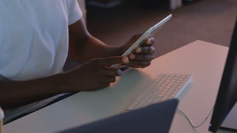 mid section of male executive working on digital tablet at desk in modern office 4k