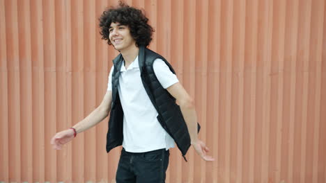 happy teenager dancing outdoors