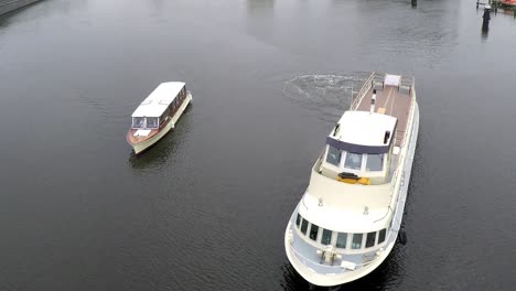 drone flying over big and small boat