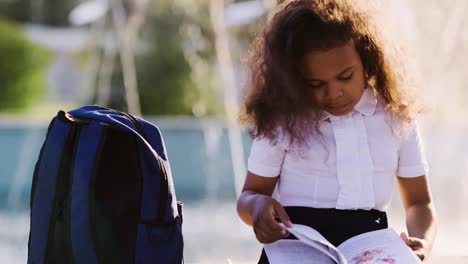 girl reading a book outdoors
