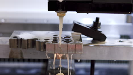 Close-up of Wire Electrical Discharge Machining (EDM) in operation