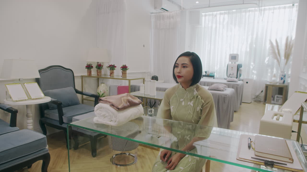 Female Receptionist Meeting Client in Spa Salon