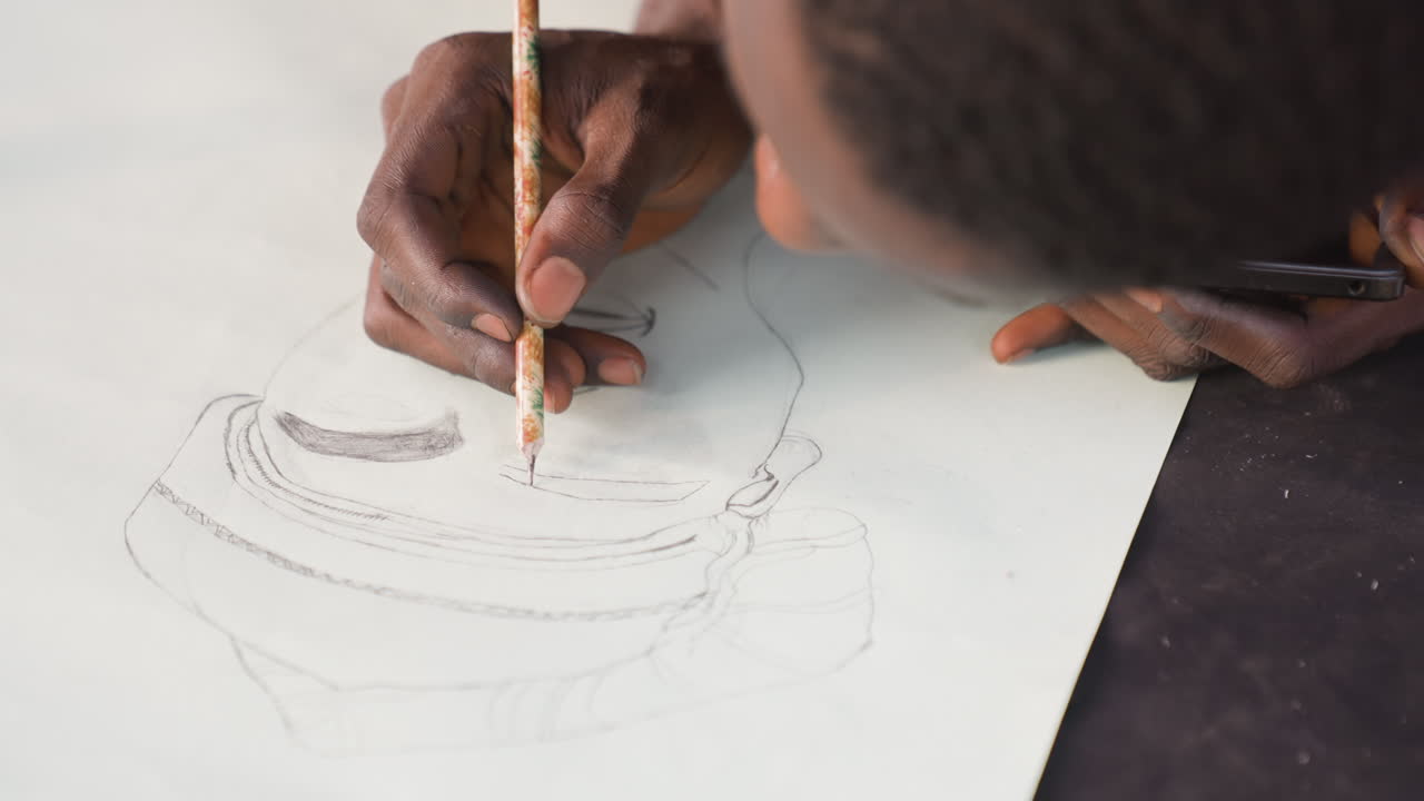 Black artist sketching portrait on paper, closeup of dark hands holding brush and pencil, delicate stippling and dotted lines shaping face, soft studio light, textured paper, focused concentration