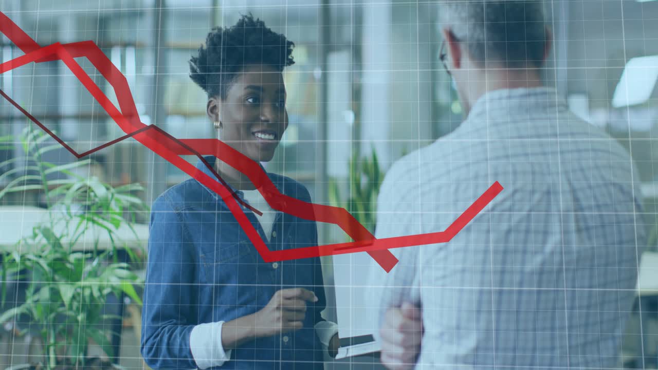 Woman initiating business presentation, tapping laptop to reveal red line chart showing shifts