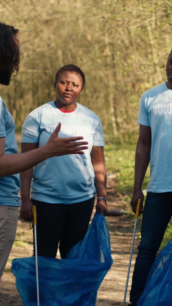 Diverse Group of Volunteers Preparing for a Park Cleanup