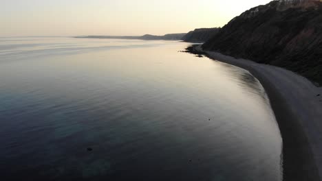 calm tranquil sunset waters beside littlecombe shoot beach