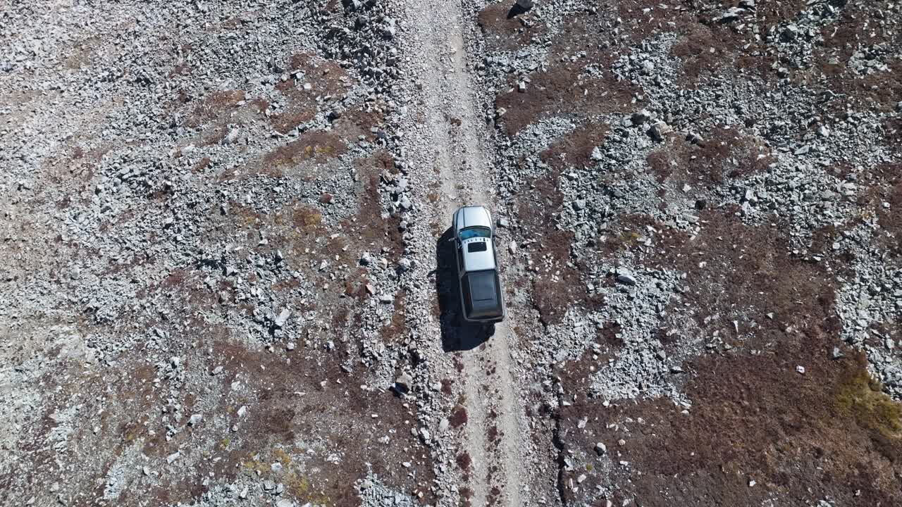 Aerial View of a Truck Driving on a Rocky Road