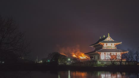 fire festival at a japanese temple at night