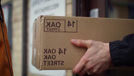 a package delivery at a service center: transitioning from arrival to handing over, capturing the process of receiving and signing for a box