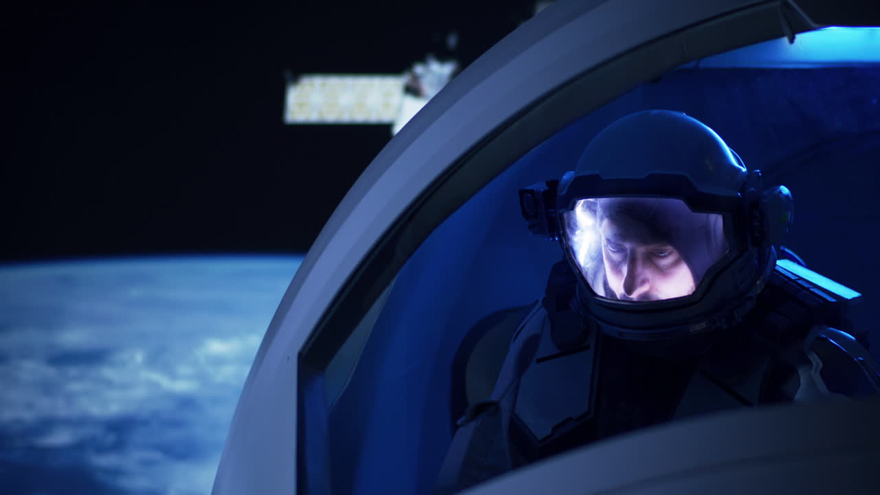 Astronaut in Spaceship Viewing Earth and Space Station