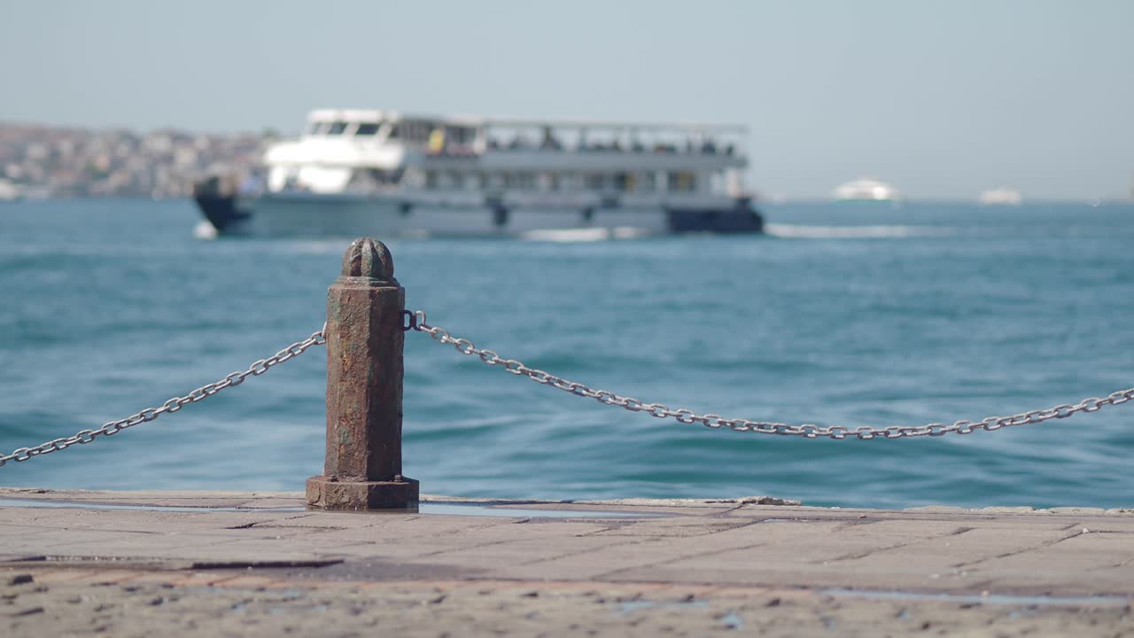 A boat on the sea near a pier