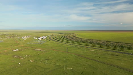a view of expansive green plains in kazakhstan, central asia - aerial drone shot