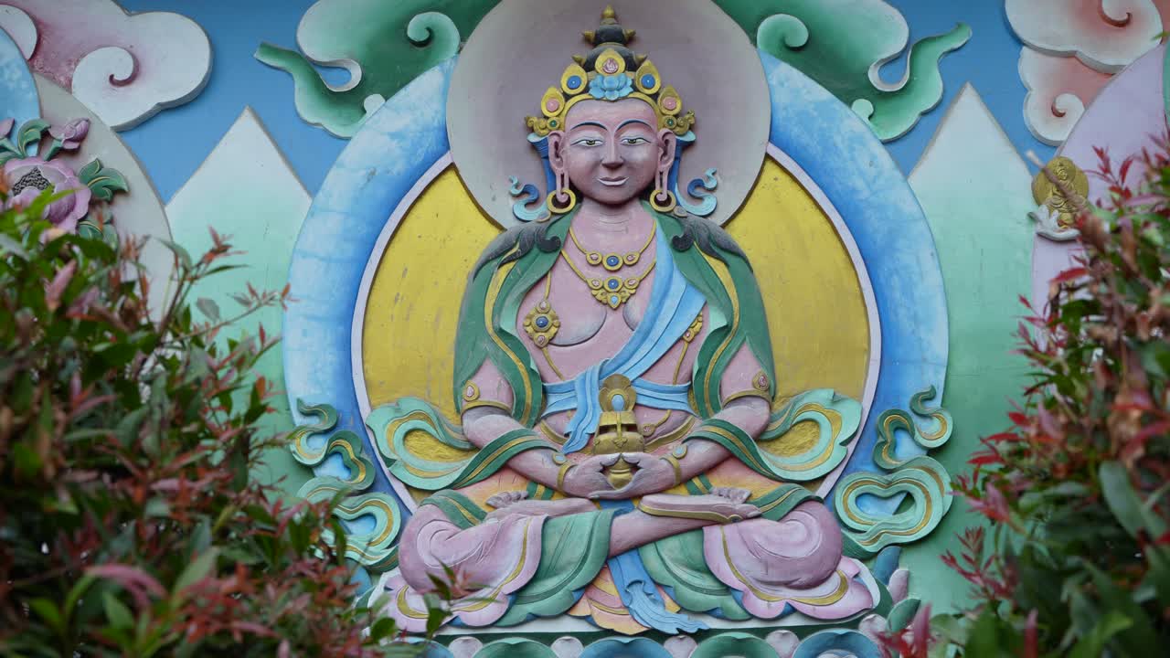 There is a painting of Gautama Buddha on the wall