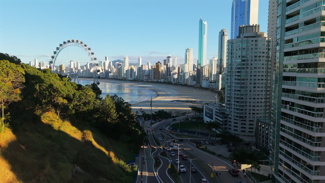 Aerial establishing fly Streets of Balneario Camboriu, Traffic, Buildings and Main Coastline of Brazilian Santa Catarina Travel destination