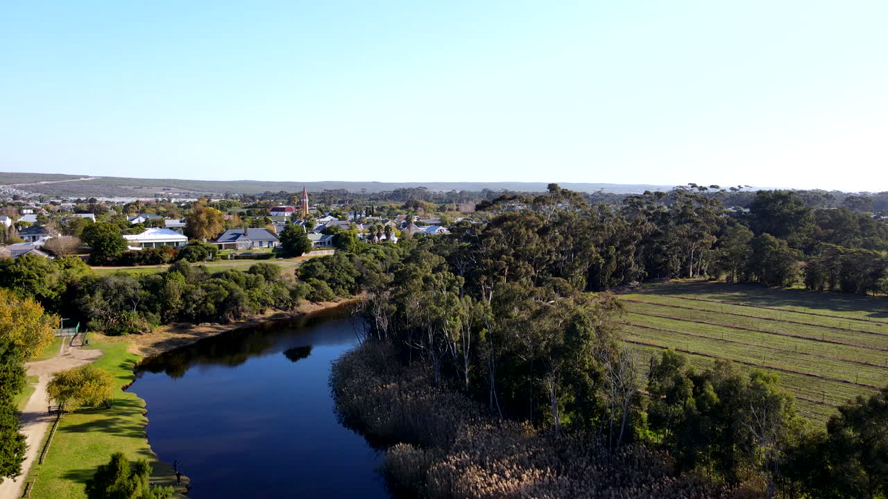 Drone riser from Klein River bank reveals countryside town Stanford in Overberg