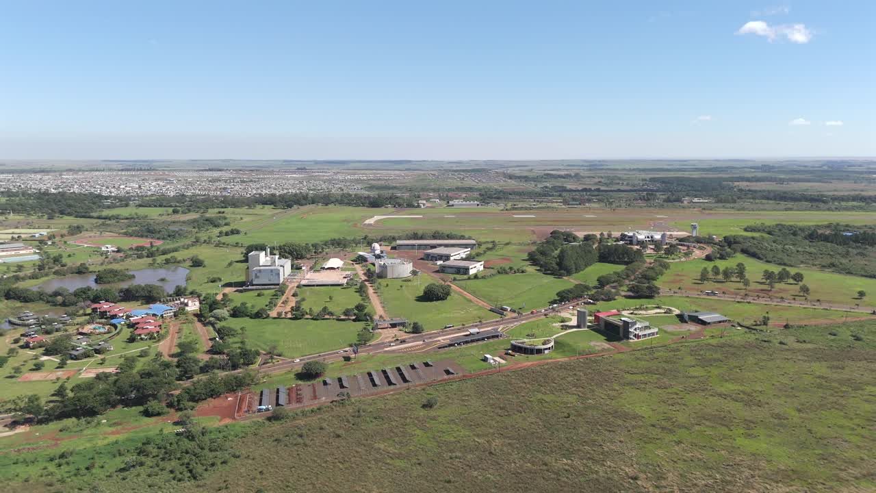Aerial panoramic view revealing Parque del Conocimiento, Silicon Misiones, Posadas Airport, and CEPARD Sports Center in Posadas, Province of Misiones, Argentina. Drone 4k.