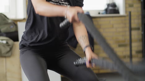 Woman,-during-training-with-ropes