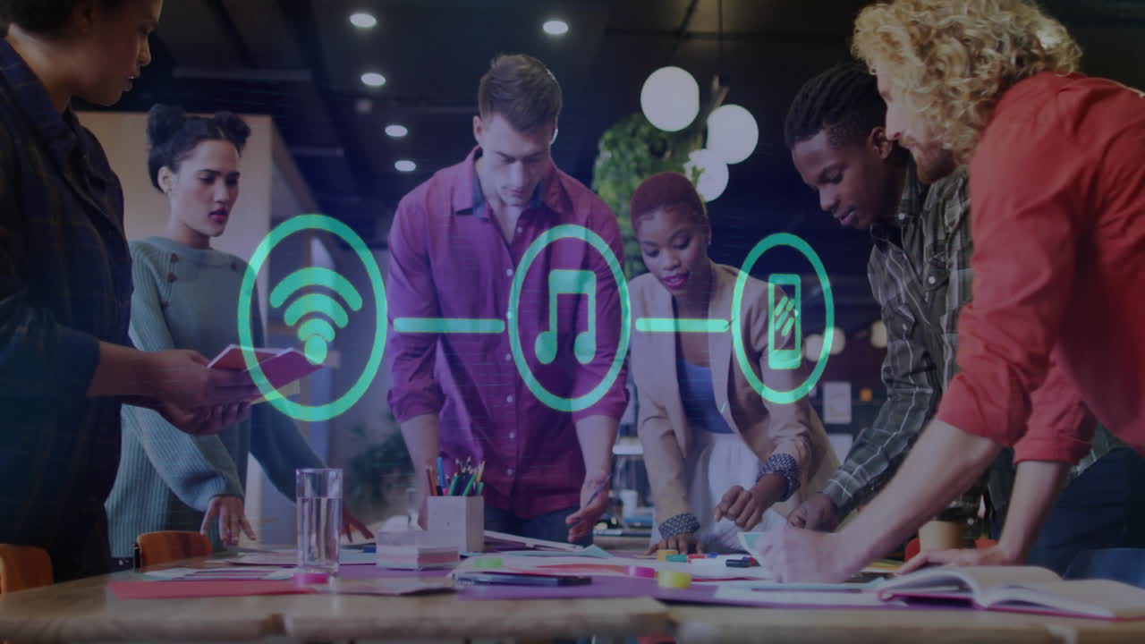 Animation of network of connections with icons over diverse colleagues having meeting in office