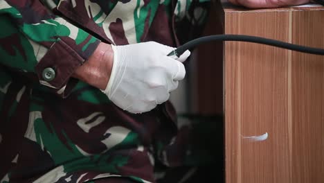 army doctor taking blood pressure of a patient