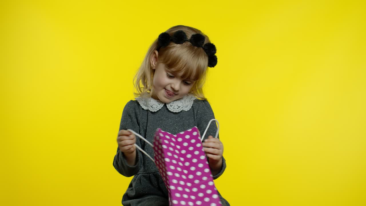 Child girl showing Black Friday inscription text advertisement. Online shopping with low prices