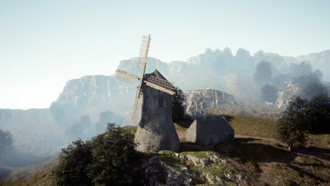 ancient windmill on a misty mountaintop