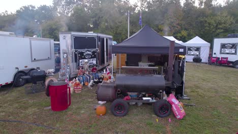 Aerial-orbit-of-the-smoker-during-the-BBQ-championships-in-Lynchburg,-TN