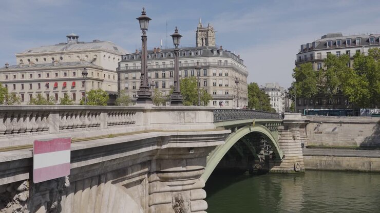 Pont Notre Dame Bridge Crossing River Seine In Paris France With Tourists