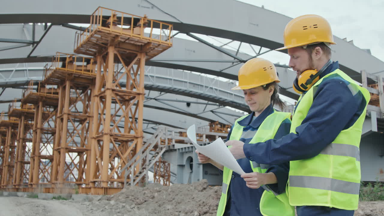 Construction Engineers Discussing Project Outside
