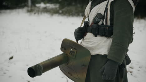 german soldier in winter uniform with anti-aircraft weapon