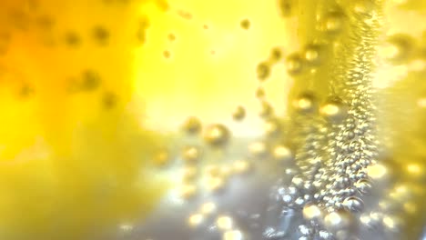 macro abstract yellow bubbles sparkling blobs into colorful bright golden fluid, creative background texture liquid art, organic fresh liquid flow