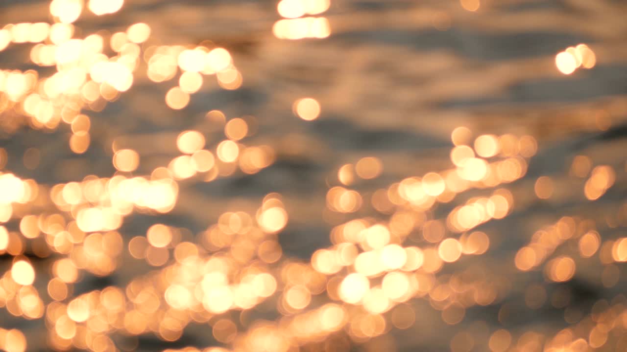Abstract blurred bokeh background of the water in twilight
