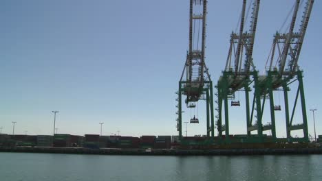 pov from boat of cranes and port at long beach harbor