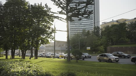 city street scene with trees and traffic