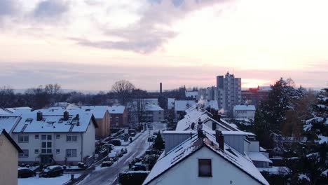 european neighborhood covered with snow, aerial view of houses covered with snow. drone moving over houses covered with snow.