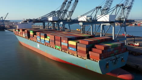 container ship at port with cranes