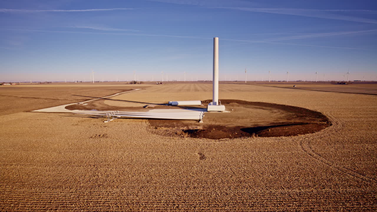 Cinematic drone shot of wind farm infrastructure taking shape in Illinois