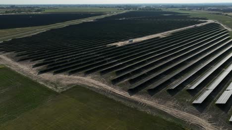 aerial revealing photovoltaic base station in unpolluted green countryside