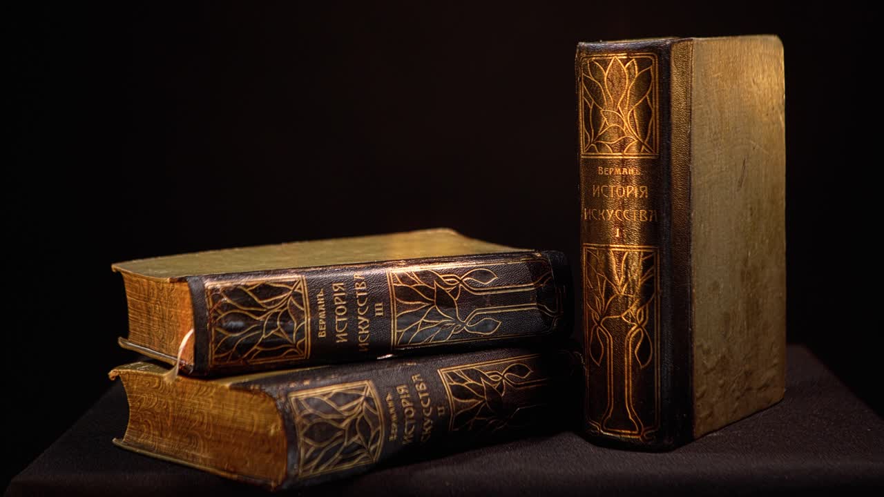 Antique History Books on Dark Background