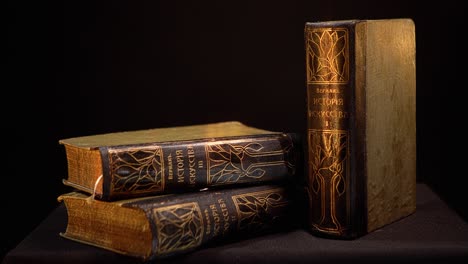 antique history books on dark background