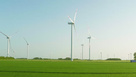 passing by wind park in northern germany on a sunny late afternoon