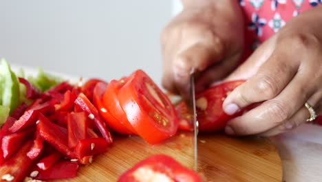 woman chopping vegetables in kitchen