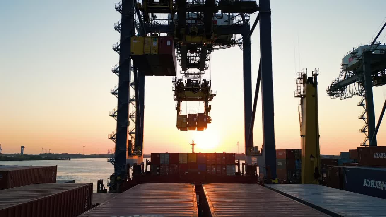 A Stunning Sunset Over a Busy Cargo Port - Cranes Hauling Containers in Twilight, Showcasing the Vibrant Colors and Industrial Operations at Dusk