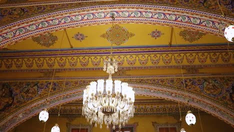 artistic design of temple roof with lighted chandelier from low angle video is taken at soni ji ki nasiya jain temple, ajmer, rajasthan, india on aug 19 2023