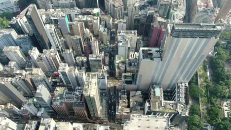 central hong kong, top down aerial view of traffic and city skyscrapers