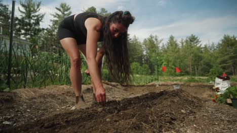 farmer planting seeds in garden k p slow