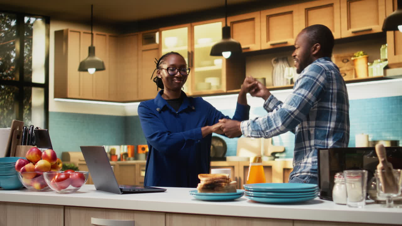 Couple Celebrating in Kitchen